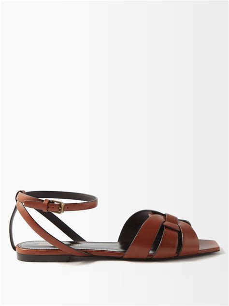 st laurent tribute flat sandals.